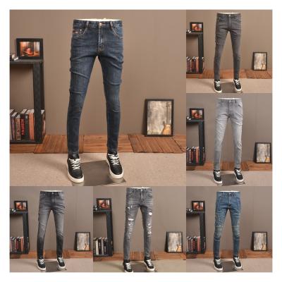 China Breathable 2024 New Men's  Old Hole Badge Pants Art Patch Motorcycle White Jeans Slim Fit Pants Men's Jeans for sale