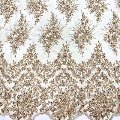 China Viable Luxury Heavy Beaded Lace Fabric Bridal Sequin Embroidery Net Flat Beads Lace Fabric For Evening Dress for sale