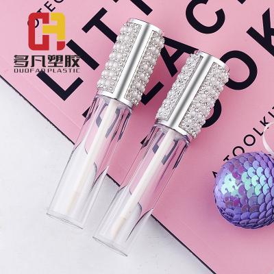 China Lips Wholesale Custom Cosmetic Lip Gloss Bottle Glitter Lip Gloss Tube With Magic Wands for sale