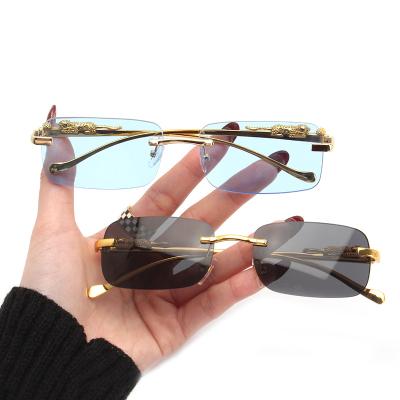 China 2022 Designer Sunglasses 100% Retro Fashion Sun Glasses Diamond Cut Women Rimless Glasses Wholesale UV Sol Lenses for sale