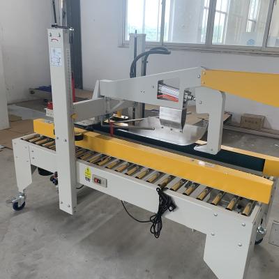 China food & Beverage shops automatic carton box packing machine/carton sealer machine/carton case box shape cartoning packing machine for sale