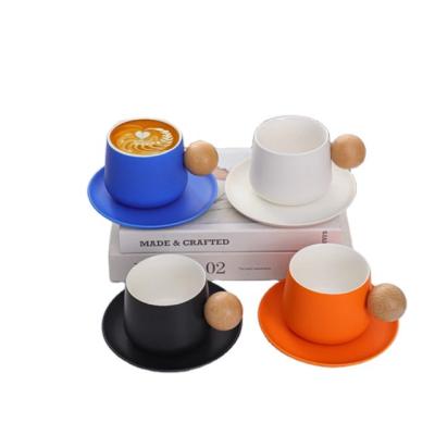 China Viable Modern Creative Couples Coffee Mug With Saucer Porcelain Cup Wooden Handle Ball Tea Cup Saucer Set Ceramic Tableware Gift for sale