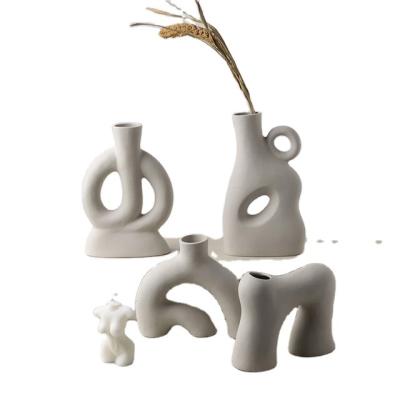 China Odd Handcrafted Matte Ceramic Vases Modern Creative Can Hold Water Irregular Shaped Decorative Vase For Modern Flower Home Decorations for sale