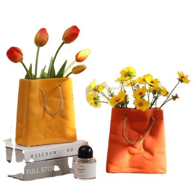 China Modern Creative Ceramic Crinkle Bag Flower Vases Personalized Handbag Vase Filler Table Shelf Container Decorative Garden Decor for sale