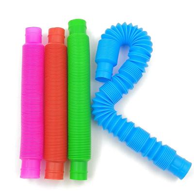 China Colorful POP TUBES 2.9CM bunmo sensory toy for adult fidgety person stress Relieve ToyKid anti stress plastic jumping tubes squeeze toy for sale