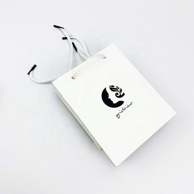 China Factory Directly Recyclable White Cardboard Printed Small Jewelry Paper Gift Bags With Rope Handles for sale