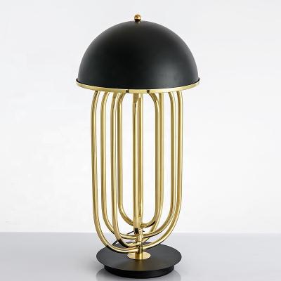 China Modern personality design indoor decorative gold rotatable geometrical led desk lamp led table lamp for living room for sale