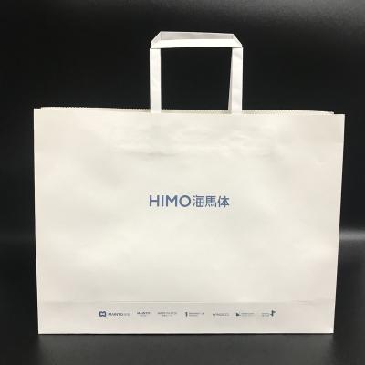 China Recyclable Custom Printed Handle Shopping Paper Bag Kraft Paper Bag With Logo for sale