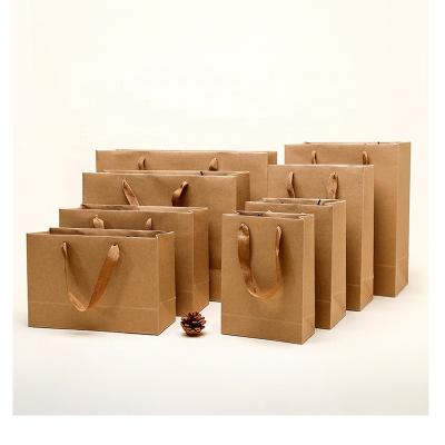 China Recycled Materials Custom Printed Brown Shopping Paper Bags Christmas Kraft Paper Gift Bag With Your Own Logo for sale