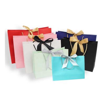 China Recycled Materials Custom Printing Luxury Gift Packaging Paper Bags Brand Clothing Store Customer Shopping Tote Bags for sale