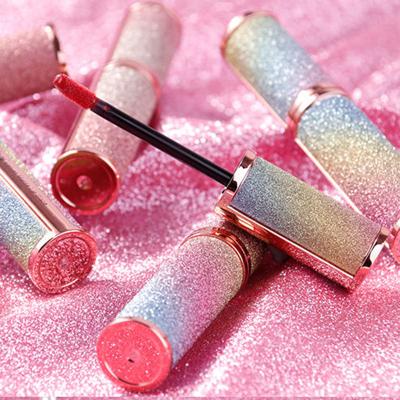 China Eco-friendly Cute Damping Light Red Purple Pink Lip Gloss Tubes Container With Wands Private Label Custom Lip Gloss for sale