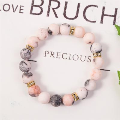 China CLASSIC hot sale 10mm Amazon charm bracelet elastic natural stone pink bracelet beads women handmade bracelet for sale