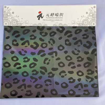 China Gray Reflective fashion polyester leopard printed reflective fabric for garment for sale