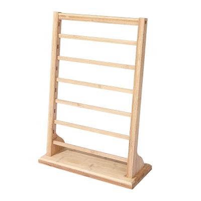 China Environmental protection wooden bamboo and wooden earrings cardboard storage display props rack for sale