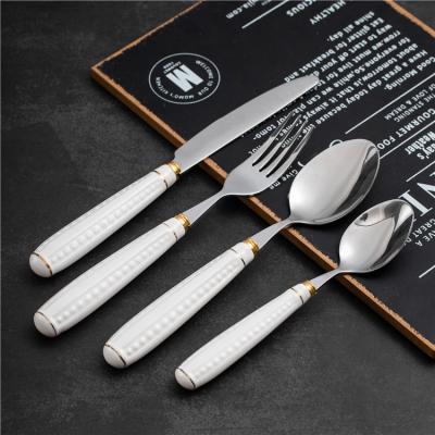 China Viable Wholesale White Ceramic Handle Stainless Steel Knife Fork And Spoon Weddings Dinnerware Metal Kitchen Cutlery Set for sale