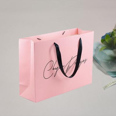 China Recyclable Popular Custom Printed Luxury Gift Paper Art Paper Bags With Handles Shopping Bag for sale