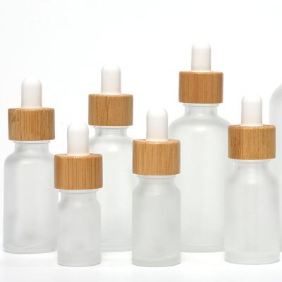 China Factory Supplier High Quality BinQi Cosmetic Wood Cap 10ml 15ml 20ml 30ml 50ml Frosted Glass Cosmetic Bottles for sale