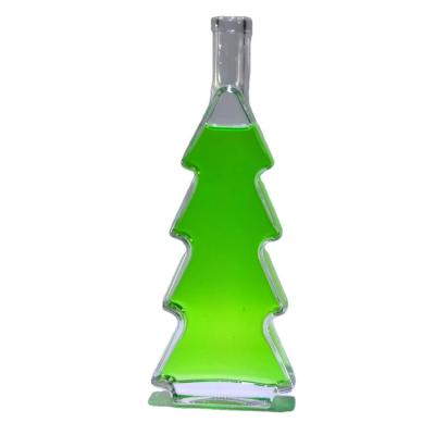 China Hot sell color customized crysta 500ml 375ml 200mlclear liquor beverage bottles Christmas tree packing jar bottles for sale