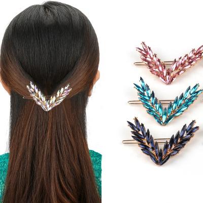 China Fashion Big Stand Gold Alloy Girls Women Feathered Ladies Hair Slides Rhinestone Hair Clips Hairpins V With Crystals for sale