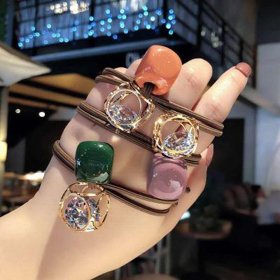 China Soft Fashion Colorful Korean Crystal Rhinestone Diamond Knot Hair Tie Of A Girls Chunky Hollow Metal Cube Elastic Hair Band for sale