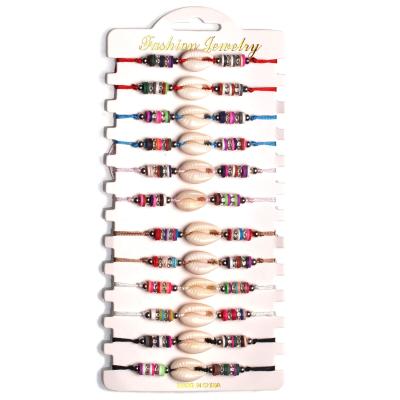 China BOHEMIA 12 Pcs Sets Charm Adjustable Woven Braided Soft Beach Shell Vinyl Disc Rope Bracelet Polymer Clay Wood Bead White Sea Bracelet for sale