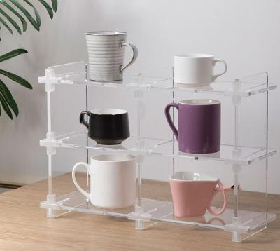 China Xinkeda Free Space 2 Tier Collapsible Riser Shelf Acrylic Stocked Display Holders for Desserts Rack Collections Organizer Shelf for sale