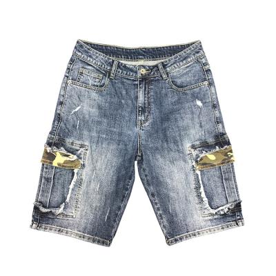 China hot sale Anti-wrinkle 2022 new men's fashion jeans shorts denim spray paint wild fabric distressed hole short pants for sale