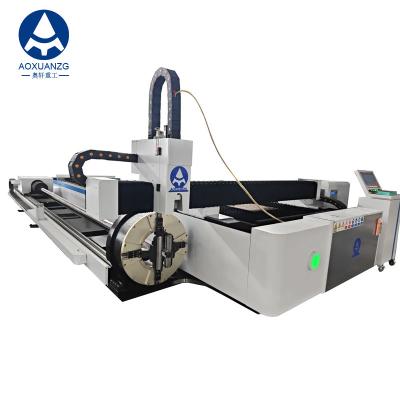 China Open type 3015 Drie Chuck Tube And Plate Fiber Laser Cutting Machine 3000w CNC Laser Cutter met uitwisselplatform Te koop