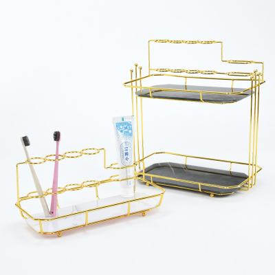 China Viable Multifunctional Toothbrush Holder Metal Gold Storage Rack Luxury Bathroom Accessories Toothpaste Dispenser for sale