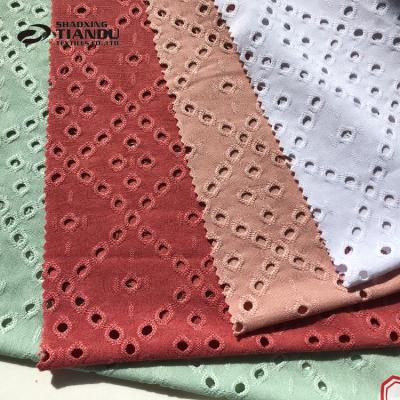 China Pill Tiandu Textiles Anti Dye Polyester Knitted Eyelet Fabric DTY Jersey Jacquard Fabric For Fashion Skirt for sale