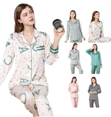 China Sale women long sleeve satin sleepwear pajamas warm comfortable QUICK DRY polyester pajamas painted posie christmas pajamas for sale