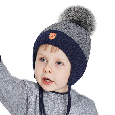 China Regular Stock Kids Boys Winter Knitted Hats With Fur Pom Pom Toddler Boy Custom Fleece Striping Warm Hat With Earflap Kids Logo Hat for sale