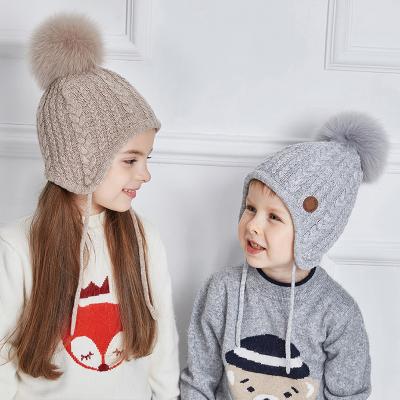 China Plain Winter Toddler Baby Boy Girls Winter Knit Hat Kids Boys Ear Flap Warm Fleece Striped Knit Beanie Fur Pom Hat Wholesale RTS for sale