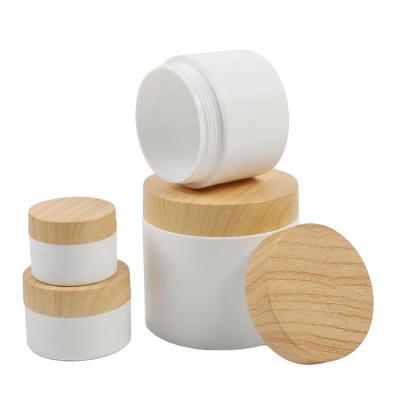 China Eco-friendly plastic face cream plastic jar 10 20 30 50 100 150 200 300ml with bamboo lid for sale