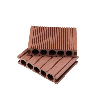 China Hoyeah Round Hole Outdoor Balcony Waterproof Mahogany Compound Plastic Wood Flooring for sale