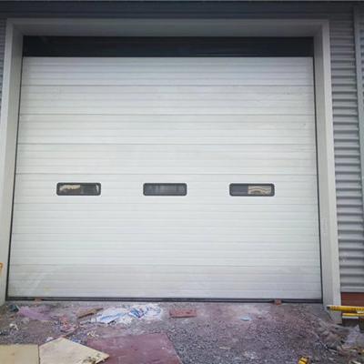 China Contemporary Manufacturer Security Elevator Rolling Sectional Door Warehouses Lifting Door for sale