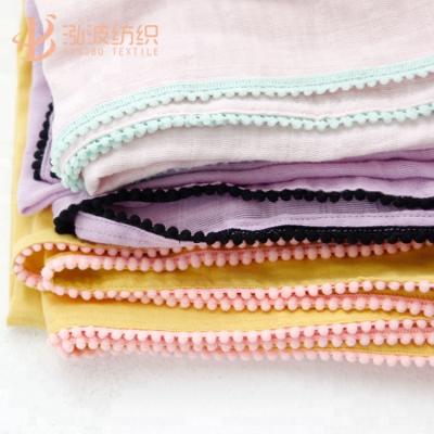 China Anti-pilling Organic Muslin Wrap Blanket for Infant, Newborn, Toddler, 100% Soft Cotton Wrap Receiving Blanket with Pom Pom for sale