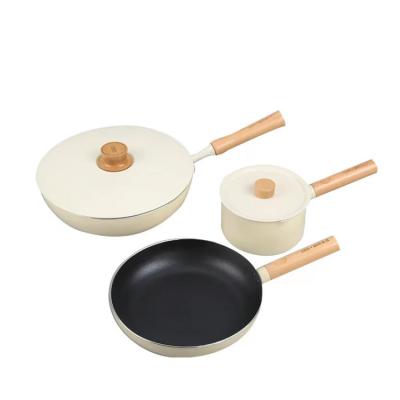 China 5pcs Non Stick Viable White Color Aluminum Cookware Pot Pan Set With Wooden Handle for sale