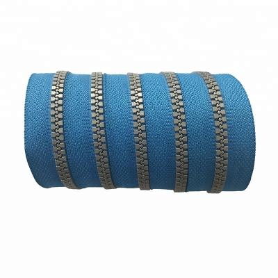 China Sustainable Design Fashion Gray Teeth Custom Color Plastic Long Chain Zipper Roll For Clothes for sale