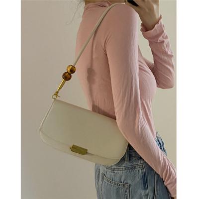 China New 2022 High Quality Vintage Pearl Shoulder Bag Elegant Women Simple Medieval Armpit Bag Armpit Handbags for sale