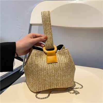 China Straw Woven Bucket Woven Handbag Beach Straw Bag Women's High Quality Summer Designer Chain Messenger Bag for sale