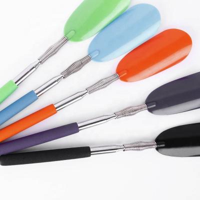 China Convenient Plastic Shoe Horn Spring Shoehorn Pusher Elastic Shoe Spoon for sale