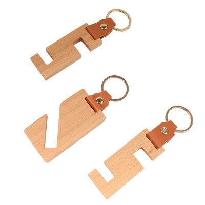 China PORTABLE Fashion Custom Logo Blank Wood Keyring Rectangular Wooden Keychain Mobile Phone Holder for sale