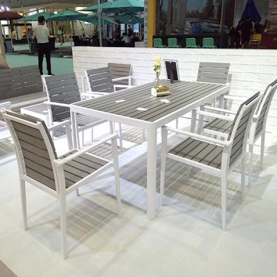 China Weather Resistant Outdoor Aluminum Dining Table Frame Wood Table And 6 Chair Set Garden Patio Furniture for sale