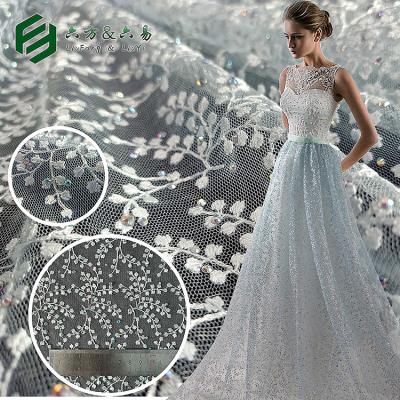 China High Quality Anti-static Elegant Rhinestone Beaded Embroidery Tulle Lace Fabric For Dress for sale