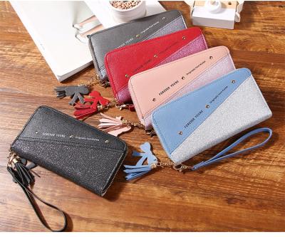 China 2021 New Fashion Durable Long Purse Bags Ladies Zipper Wallet Tassel All-match Cell Phone Bag for sale