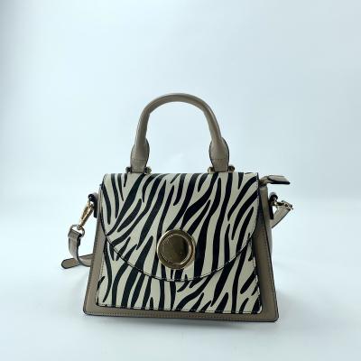 China Fashion PU Clips New Luxury Women Handbags Zebra Print Handbag For Women for sale