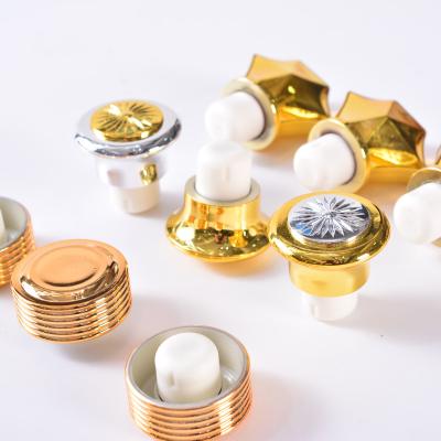 China Bottles Wholesale Custom Gold Bottle Stopper Silicone Wine Stopper Plastic Bottle Cover Bottle Caps for sale