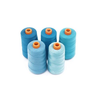 China Good quality china manufacture high tenacity 100% spun polyester 20/3 durable blue jeans sewing thread for heavy fabric for sale