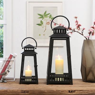 China Home Decoration Around Hanging Vertical Stripe Hollow Out Metal Lantern For Candle Windproof Holder Metal Candle Antique Lantern for sale